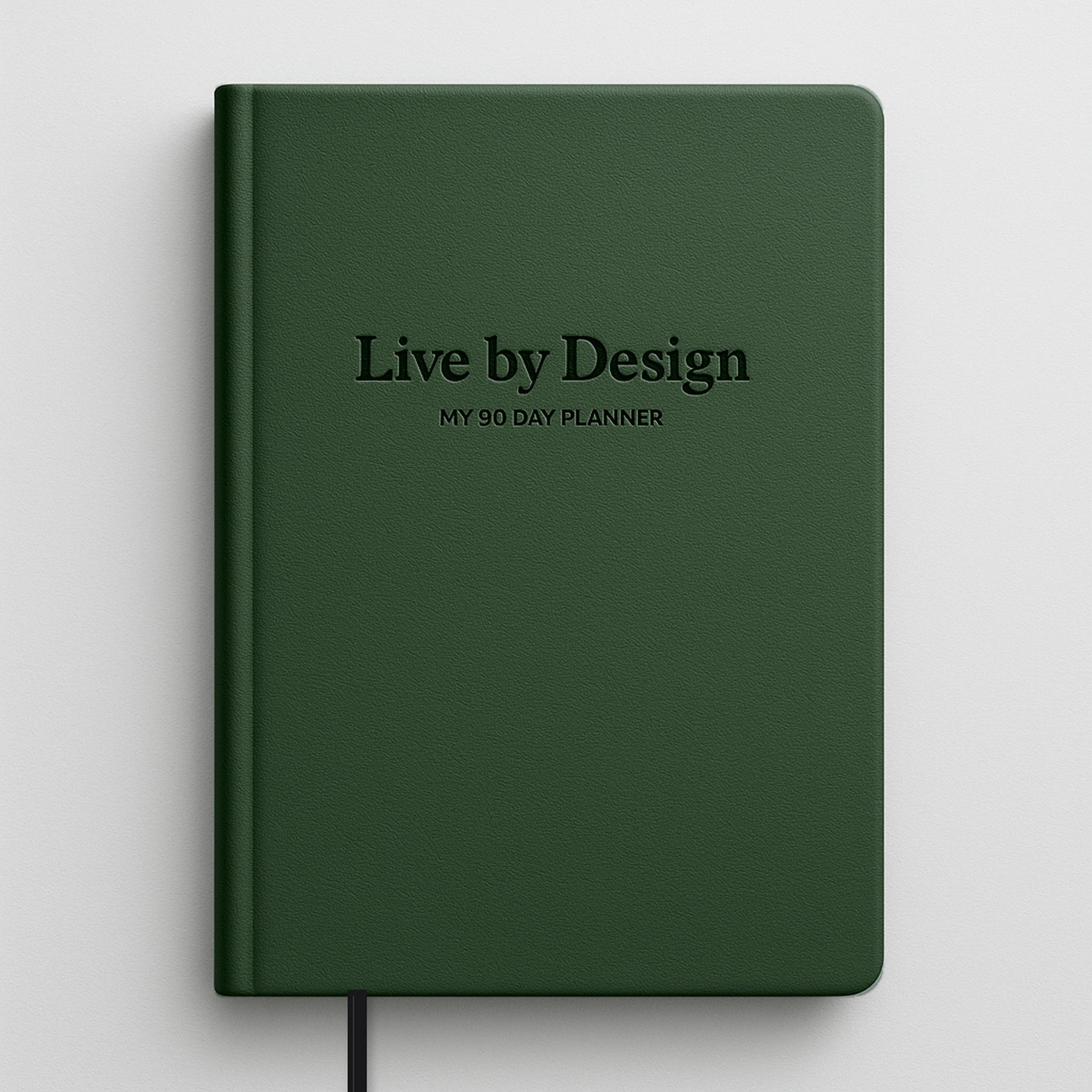 My 90 Day Planner, Live by Design: A5 hardcover in forest-green faux leather with debossed title and black ribbon bookmark