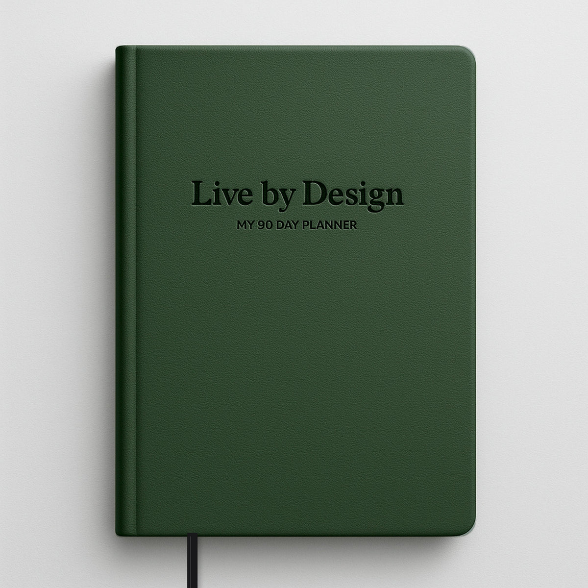 My 90 Day Planner, Live by Design: A5 hardcover in forest-green faux leather with debossed title and black ribbon bookmark